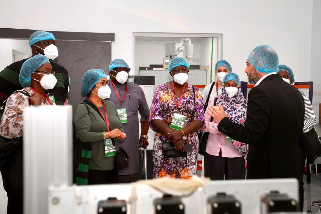 Dr. Selim Hani leads the delegation through the production floor